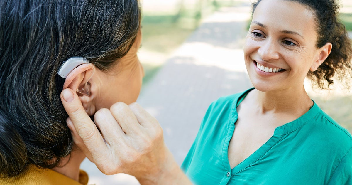 Professional audiologist providing consultation to patient